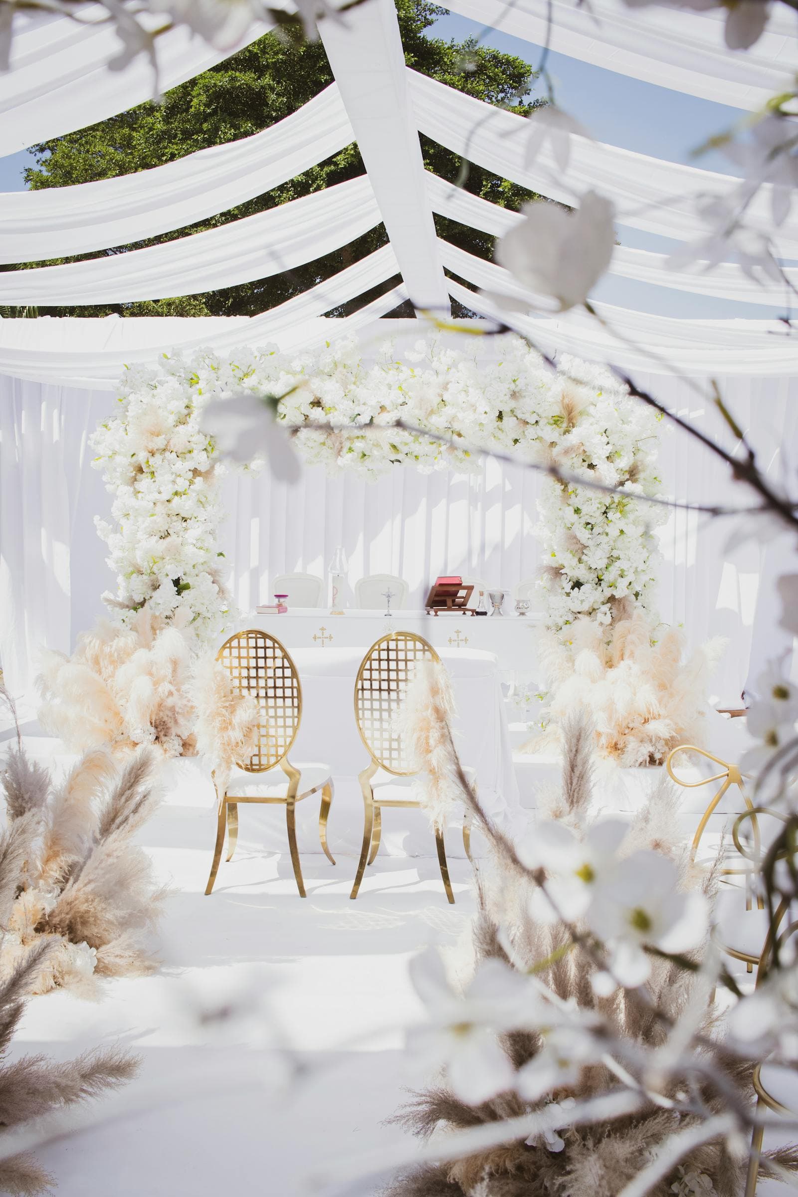 An elegant white-themed wedding reception setup